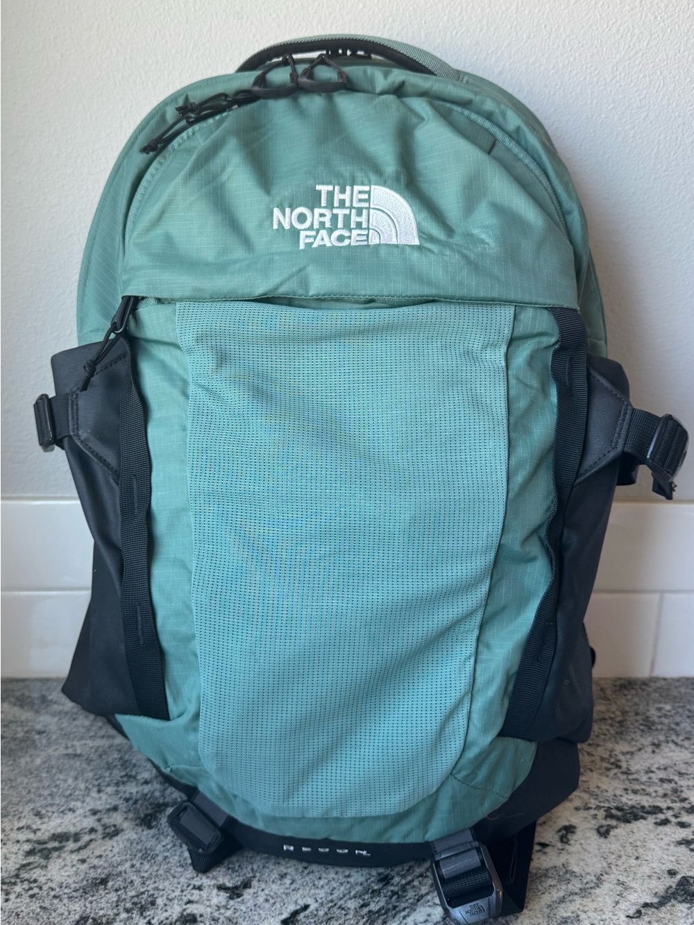 The North Face Recon Backpack in the Misty Sage Dark Heather. EUC